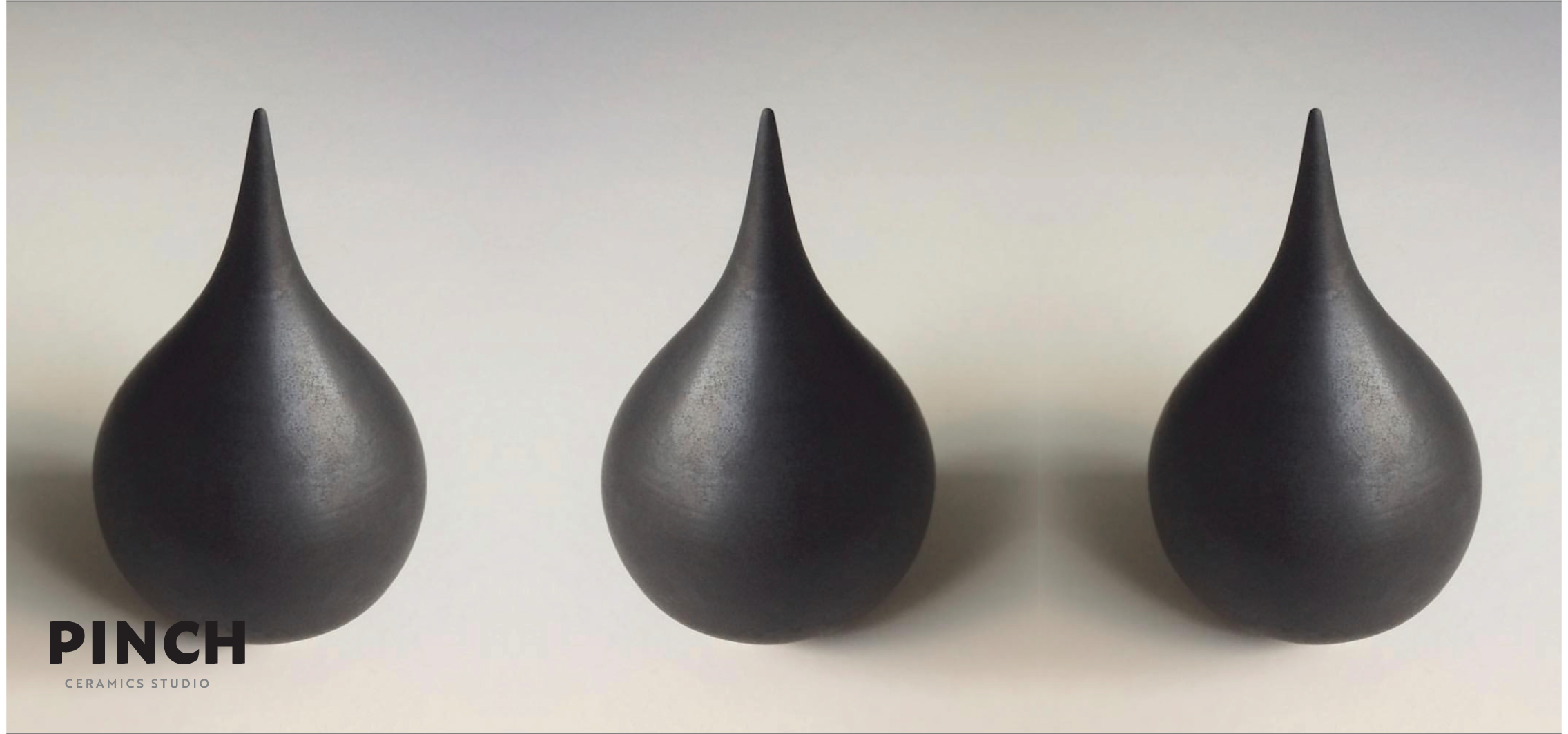 PINCH Ceramics Studio — three matte black teardrop vessels